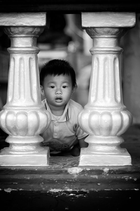 Child & banisters at Shwedagon Pagoda Yangon Burma by doss@yours