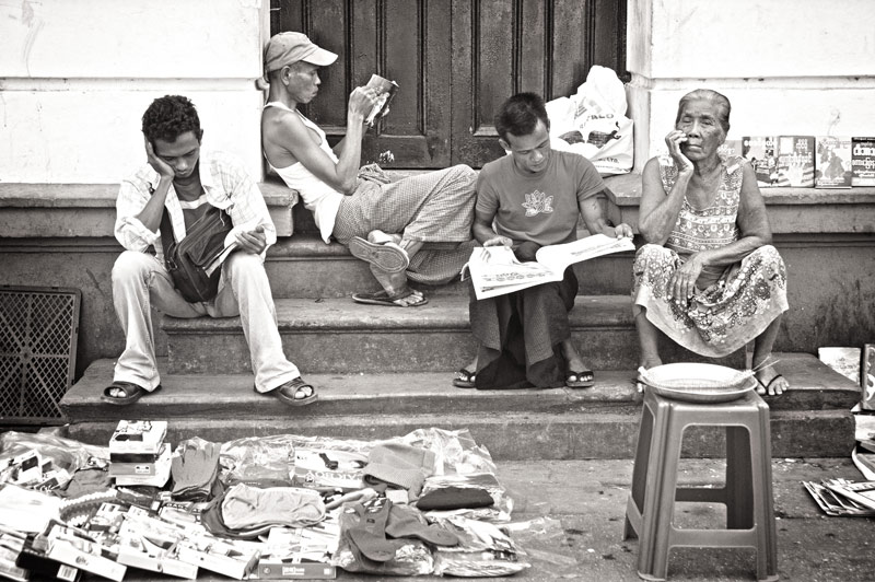 Street Photography - reading in Yangon Burma by Doss@yours